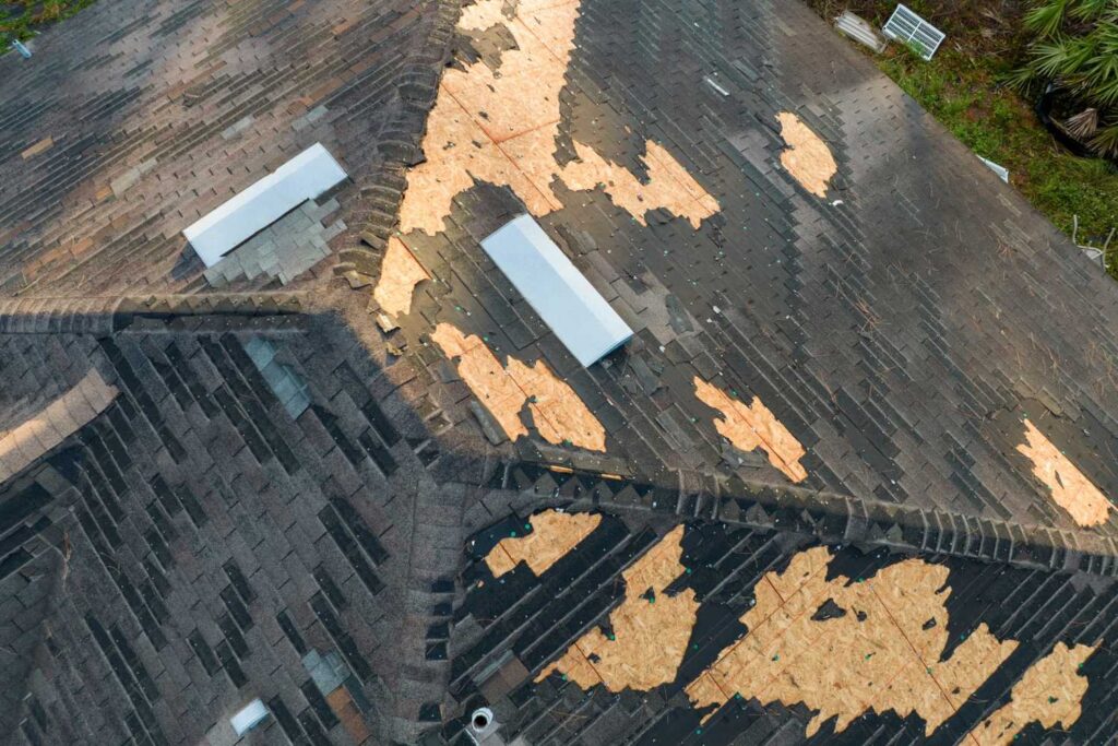 The Importance of Timely Roof Repair for Louisville Homeowners 1 Close-up of wind-damaged shingles after a Louisville summer storm